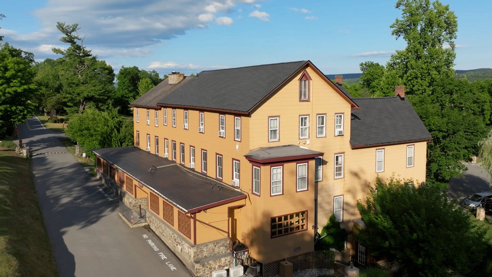Full roof replacement — historic inn after